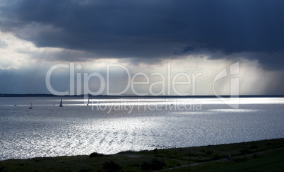 boats under dark sky