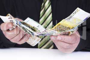 successful businessman counting his money