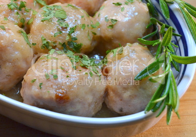 Meatballs cooked in a white bowl