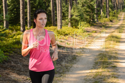 woman running through forest outdoor training