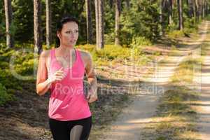 woman running through forest outdoor training