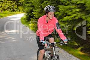 woman mountain biking motion blur cycling path