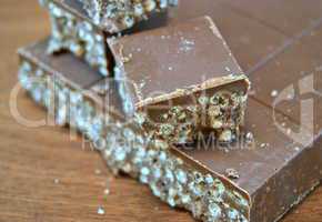 Nougat chocolate on wooden table