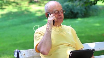 Senior man talking on smart phone