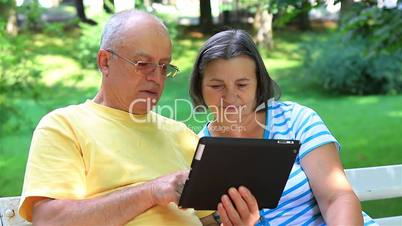 Senior couple with tablet pc