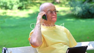 Senior man talking on smart phone