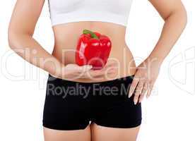 woman holding red bell pepper