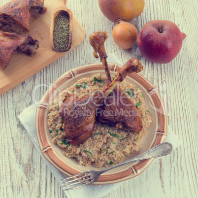 roasted goose thighs with grits - retro vintage