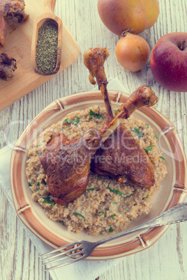 roasted goose thighs with grits - retro vintage