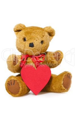süßer teddybär mit rotem herz vor der brust