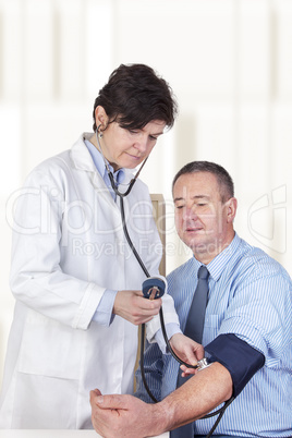 doctor measures the blood pressure in patients
