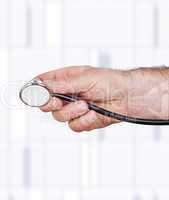 hand with stethoscope