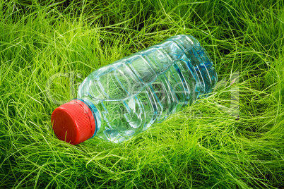 water bottle on the grass.