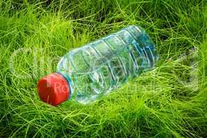 water bottle on the grass.