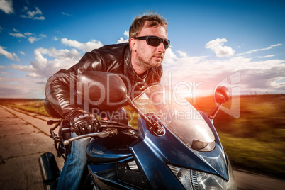 biker racing on the road