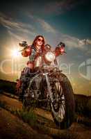 biker girl sitting on motorcycle