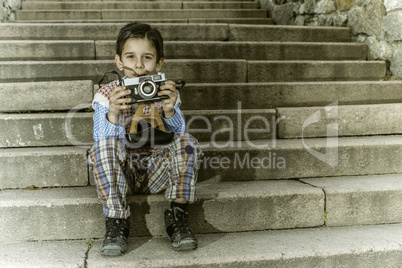 Child with vintage camera