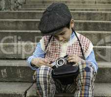 Child with vintage camera