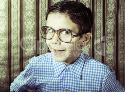 Smiling child with glasses in vintage clothes