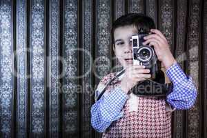 Child taking pictures with vintage camera