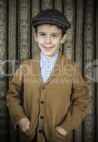 Smiling child in vintage clothes and hat
