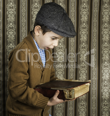 Child with red vintage book