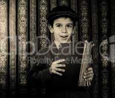 Child with red vintage book