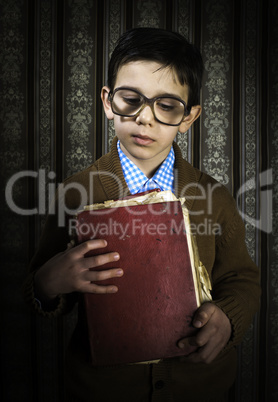 Child with red vintage book