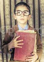 Child with red vintage book