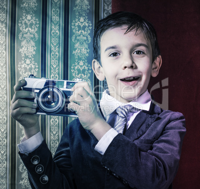 Child taking pictures with vintage camera