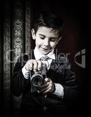 Child taking pictures with vintage camera