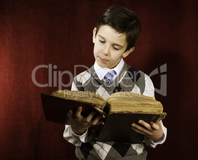 Child with red vintage book