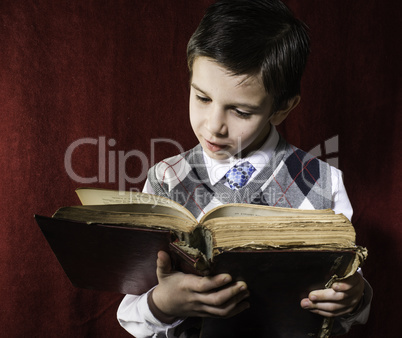 Child with red vintage book