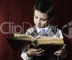 Child with red vintage book