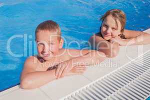 girl and boy in swimming pool