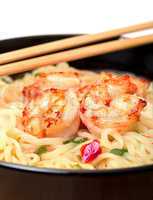 shrimp and noodle soup bowl with chopsticks