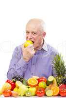 senior man eating a green apple
