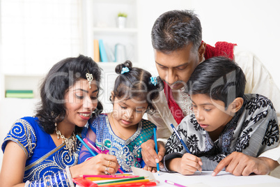 indian family painting picture at home