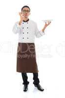 asian chef holding a plate