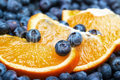 freshly picked blueberries with orange