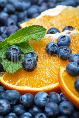 freshly picked blueberries with orange