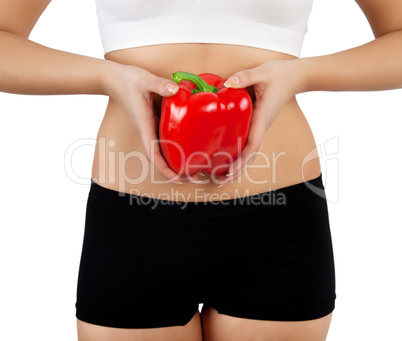 woman holding red bell pepper