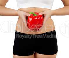 woman holding red bell pepper