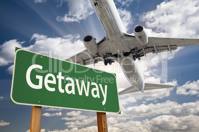 Getaway Green Road Sign and Airplane Above