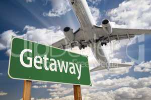 Getaway Green Road Sign and Airplane Above