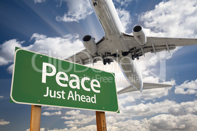 Peace Green Road Sign and Airplane Above