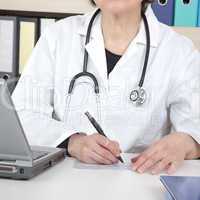 doctor writes prescription for patients