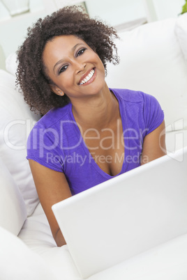 mixed race african american girl using laptop computer