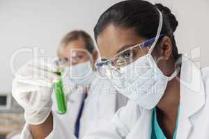 female asian scientist with test tube in laboratory