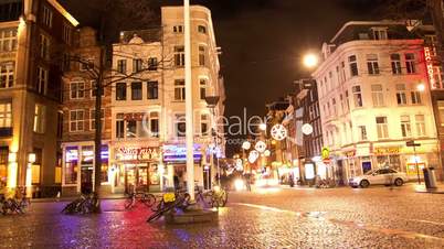 the center of amsterdam at night. time lapse.